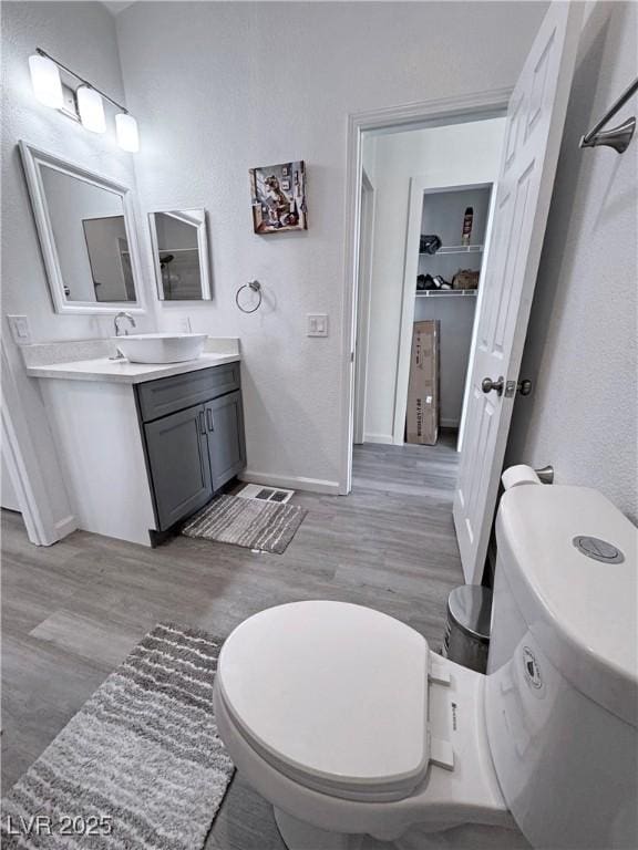 2530 Commercial Dr, Pahrump, NV 89048 - bathroom with vanity and wood finished floors