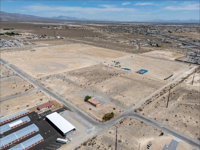 2530 Commercial Dr, Pahrump, NV 89048 - aerial view of property's location with a mountain backdrop and rural landscape