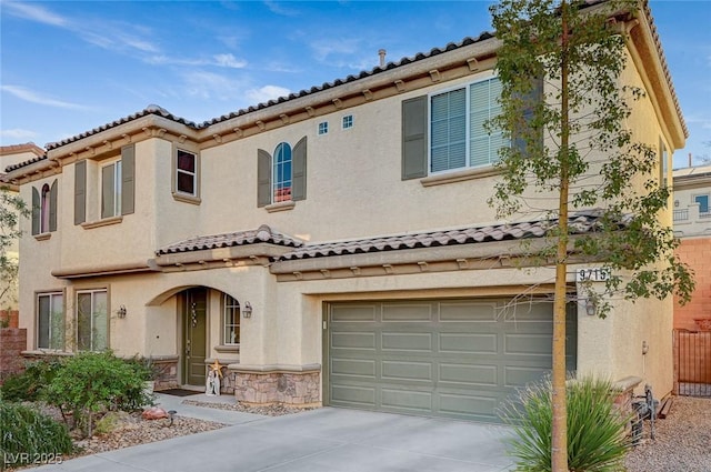 9715 Aleutian St, Las Vegas, NV 89178 - mediterranean / spanish home with stucco siding, driveway, an attached garage, and a tiled roof