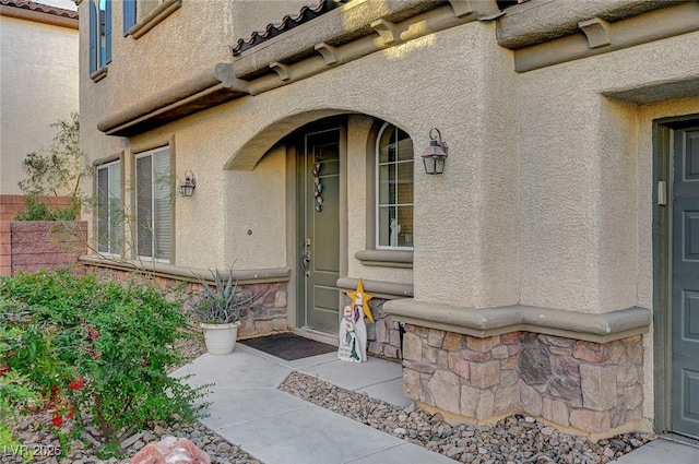 9715 Aleutian St, Las Vegas, NV 89178 - doorway to property with stucco siding and stone siding