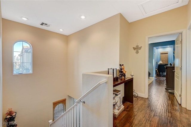9715 Aleutian St, Las Vegas, NV 89178 - hall with an upstairs landing, dark wood-type flooring, attic access, and recessed lighting