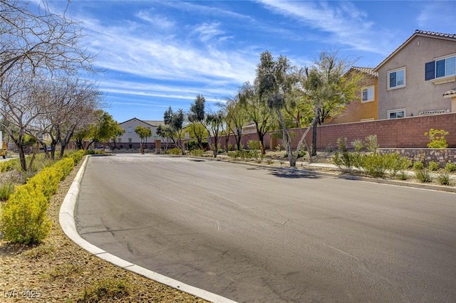 9715 Aleutian St, Las Vegas, NV 89178 - view of asphalt street with curbs and a residential view