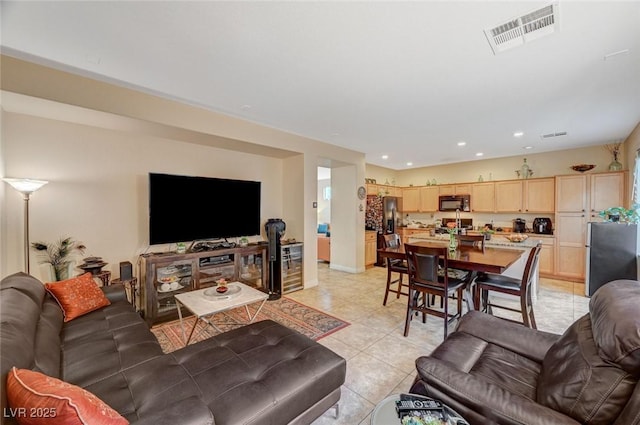 9715 Aleutian St, Las Vegas, NV 89178 - living room featuring light tile patterned flooring and recessed lighting