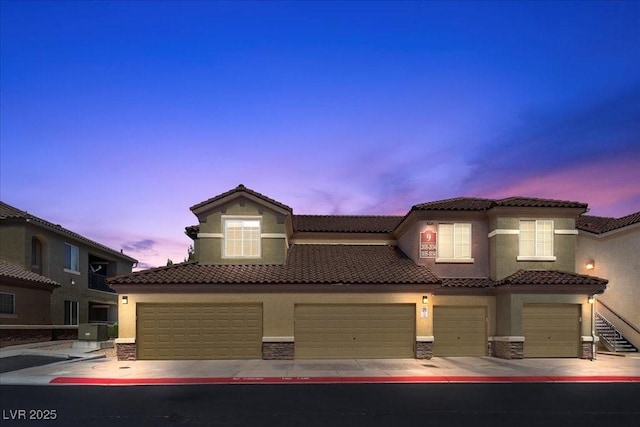 6868 Sky Pointe Dr Unit 2035, Las Vegas, NV 89131 - view of front of house featuring stucco siding and a tiled roof