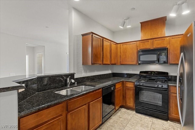 6868 Sky Pointe Dr Unit 2035, Las Vegas, NV 89131 - kitchen with black appliances, light tile patterned floors, brown cabinets, and dark stone counters