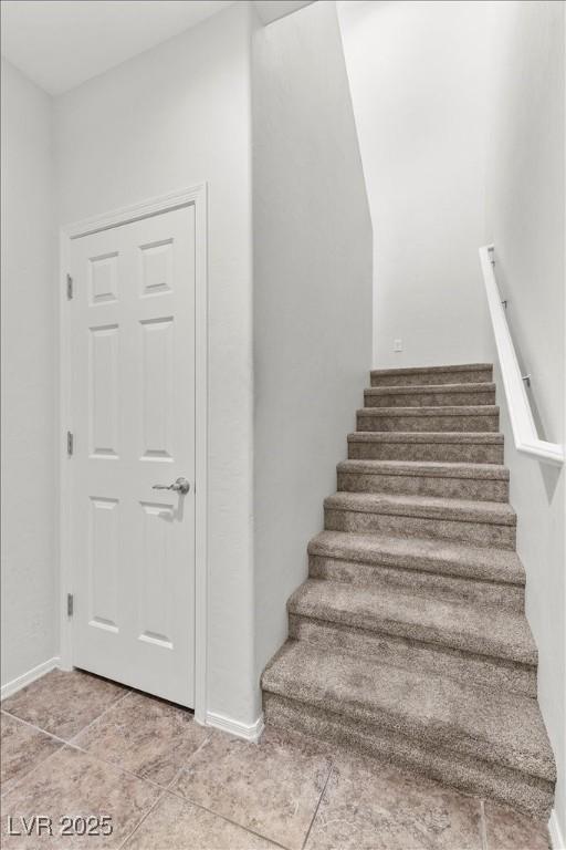 6868 Sky Pointe Dr Unit 2035, Las Vegas, NV 89131 - staircase with tile patterned floors and baseboards