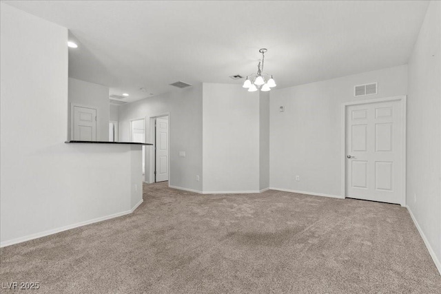 6868 Sky Pointe Dr Unit 2035, Las Vegas, NV 89131 - carpeted empty room featuring a chandelier and recessed lighting