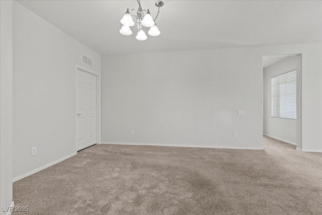 6868 Sky Pointe Dr Unit 2035, Las Vegas, NV 89131 - empty room with a chandelier and carpet