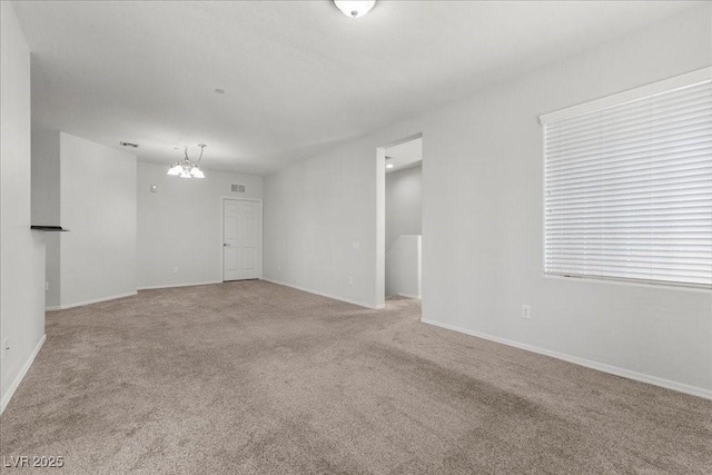 6868 Sky Pointe Dr Unit 2035, Las Vegas, NV 89131 - carpeted empty room featuring a chandelier and baseboards