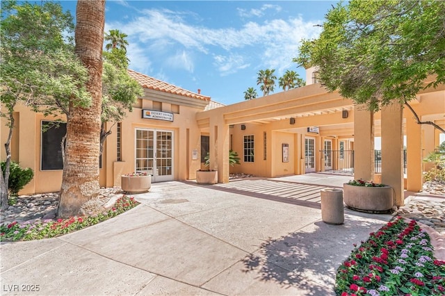 3151 Soaring Gulls Dr Unit 1021, Las Vegas, NV 89128 - rear view of house with stucco siding and a tile roof