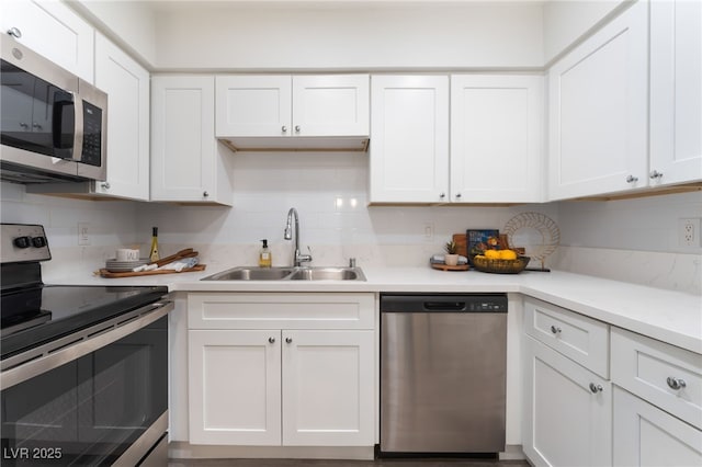 3151 Soaring Gulls Dr Unit 1021, Las Vegas, NV 89128 - kitchen featuring appliances with stainless steel finishes, white cabinets, light countertops, and decorative backsplash