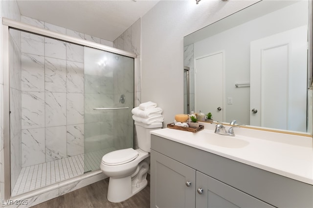 3151 Soaring Gulls Dr Unit 1021, Las Vegas, NV 89128 - bathroom featuring a marble finish shower, vanity, and wood finished floors