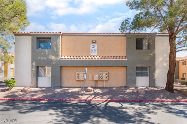 3151 Soaring Gulls Dr Unit 1021, Las Vegas, NV 89128 - view of front of home with stucco siding and a tile roof