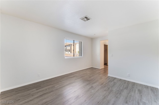 3151 Soaring Gulls Dr Unit 1021, Las Vegas, NV 89128 - spare room featuring wood finished floors and baseboards