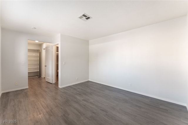 3151 Soaring Gulls Dr Unit 1021, Las Vegas, NV 89128 - empty room featuring dark wood-type flooring and baseboards