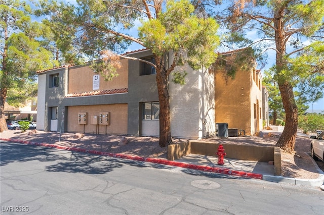 3151 Soaring Gulls Dr Unit 1021, Las Vegas, NV 89128 - view of front facade with stucco siding and a tiled roof