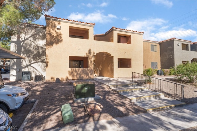 3151 Soaring Gulls Dr Unit 1021, Las Vegas, NV 89128 - view of front of home featuring stucco siding and a tiled roof