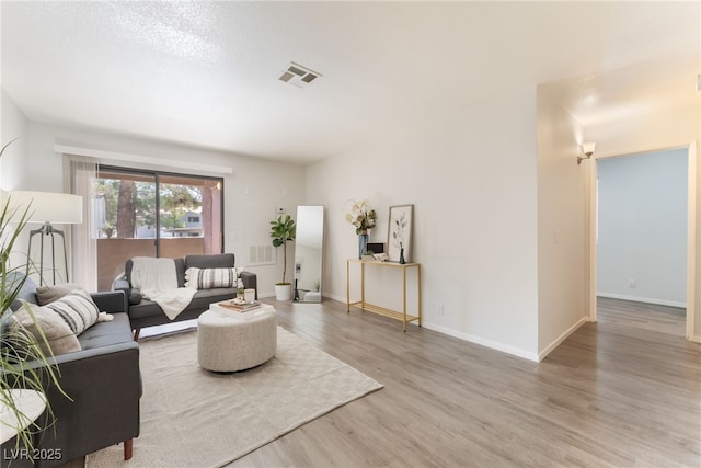 3151 Soaring Gulls Dr Unit 1021, Las Vegas, NV 89128 - living room featuring light wood-type flooring