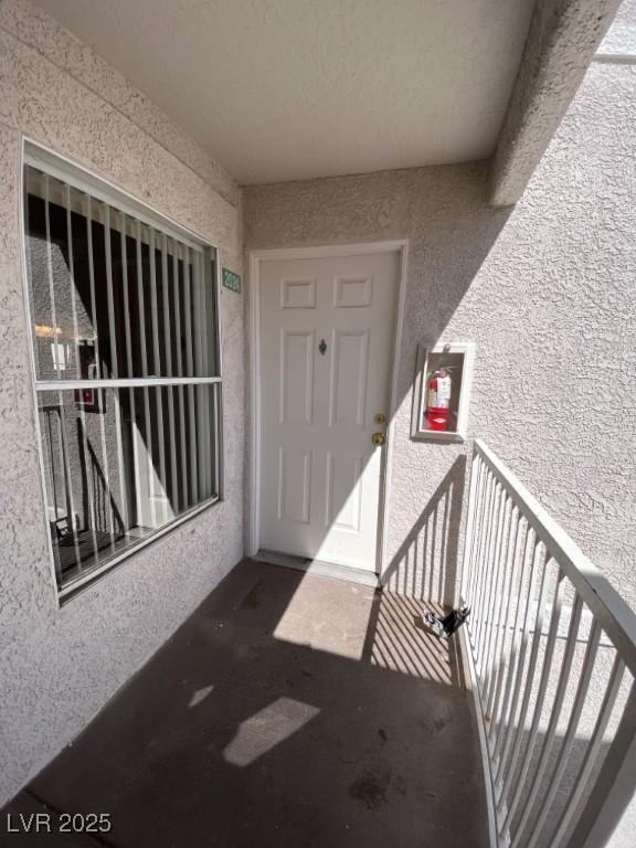 6800 E Lake Mead Blvd Unit 2024, Las Vegas, NV 89156 - entrance to property featuring stucco siding and a balcony
