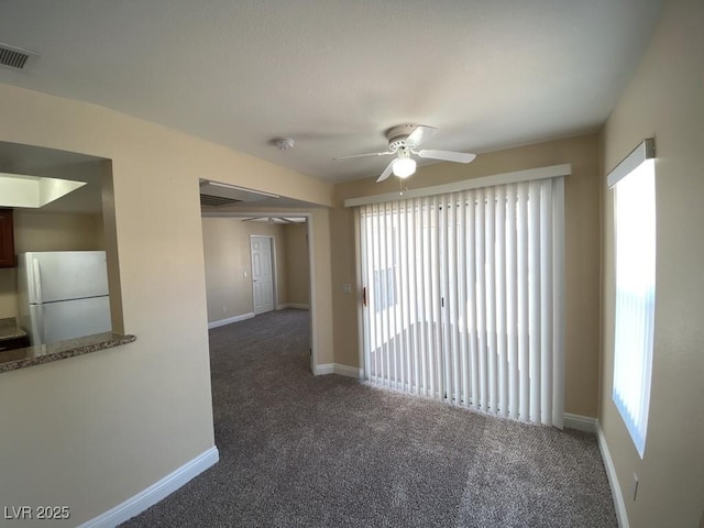 6800 E Lake Mead Blvd Unit 2024, Las Vegas, NV 89156 - carpeted empty room with a ceiling fan, plenty of natural light, and a smoke detector