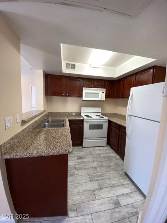 6800 E Lake Mead Blvd Unit 2024, Las Vegas, NV 89156 - kitchen with white appliances and a peninsula