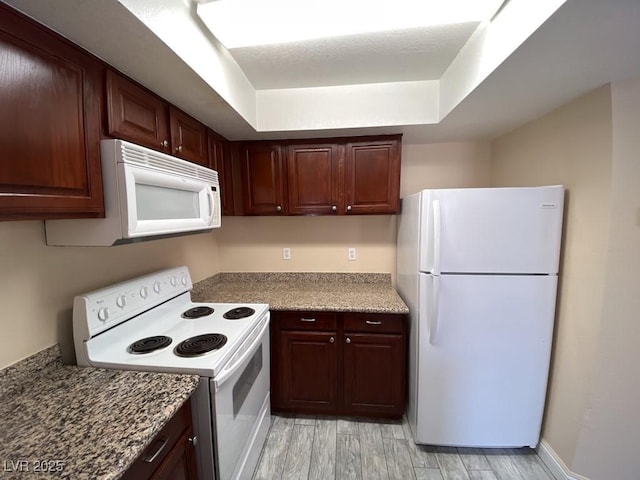 6800 E Lake Mead Blvd Unit 2024, Las Vegas, NV 89156 - kitchen with white appliances and light wood-style floors