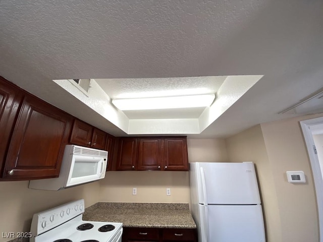 6800 E Lake Mead Blvd Unit 2024, Las Vegas, NV 89156 - kitchen featuring white appliances and a textured ceiling