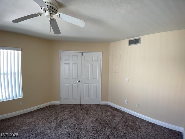 6800 E Lake Mead Blvd Unit 2024, Las Vegas, NV 89156 - unfurnished bedroom featuring carpet, electric panel, a closet, and a ceiling fan