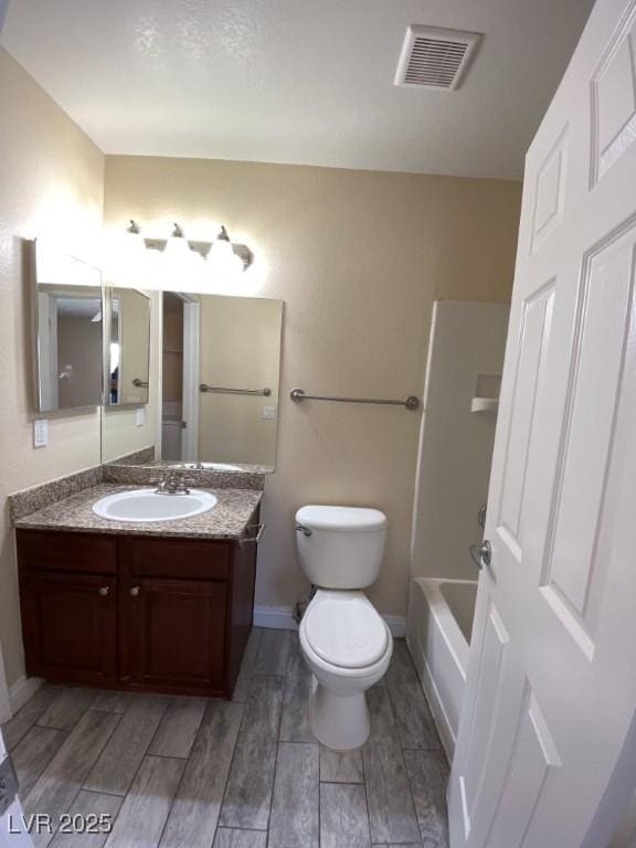 6800 E Lake Mead Blvd Unit 2024, Las Vegas, NV 89156 - full bath featuring wood tiled floors, vanity, and tub / shower combination
