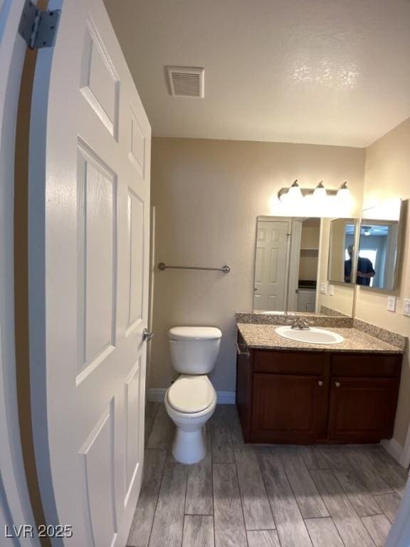 6800 E Lake Mead Blvd Unit 2024, Las Vegas, NV 89156 - bathroom featuring vanity and wood finished floors