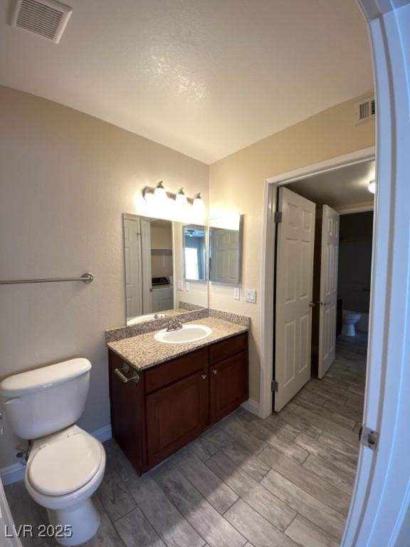 6800 E Lake Mead Blvd Unit 2024, Las Vegas, NV 89156 - bathroom featuring vanity and wood finished floors