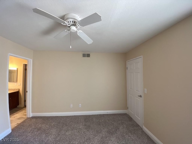 6800 E Lake Mead Blvd Unit 2024, Las Vegas, NV 89156 - unfurnished room featuring light colored carpet and a ceiling fan