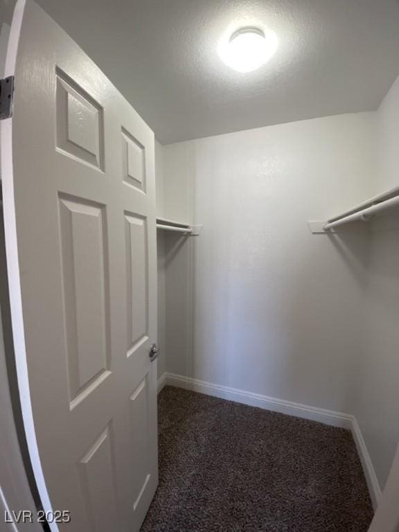 6800 E Lake Mead Blvd Unit 2024, Las Vegas, NV 89156 - spacious closet featuring dark carpet