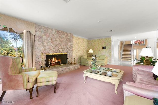 226 Dalmatian Ln, Las Vegas, NV 89107 - living area with a stone fireplace, wallpapered walls, stairway, and carpet