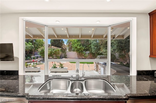 226 Dalmatian Ln, Las Vegas, NV 89107 - kitchen featuring dark stone counters and recessed lighting