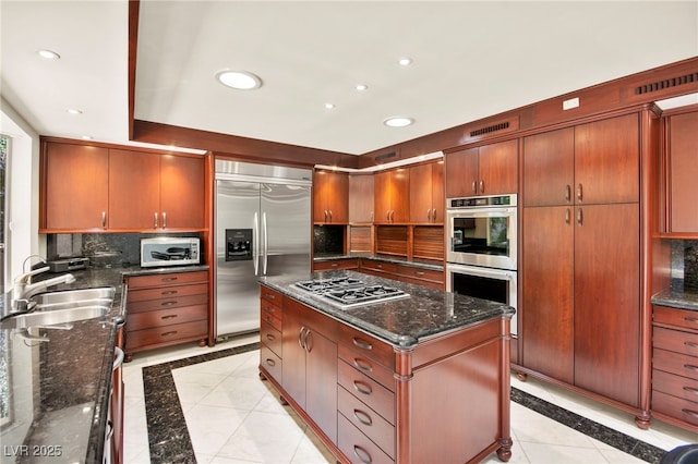 226 Dalmatian Ln, Las Vegas, NV 89107 - kitchen with appliances with stainless steel finishes, inlaid floor details, recessed lighting, and tasteful backsplash