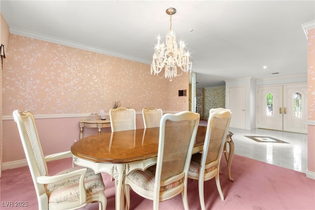 226 Dalmatian Ln, Las Vegas, NV 89107 - dining space featuring crown molding, a chandelier, and wallpapered walls