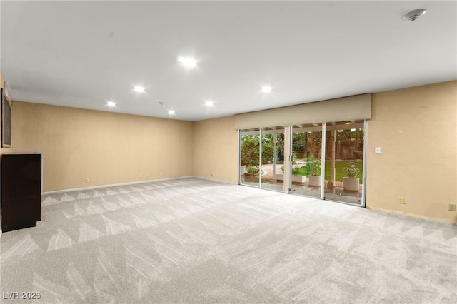 226 Dalmatian Ln, Las Vegas, NV 89107 - unfurnished living room with recessed lighting and light colored carpet