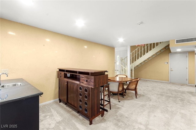 226 Dalmatian Ln, Las Vegas, NV 89107 - indoor bar with stairs, light carpet, and recessed lighting