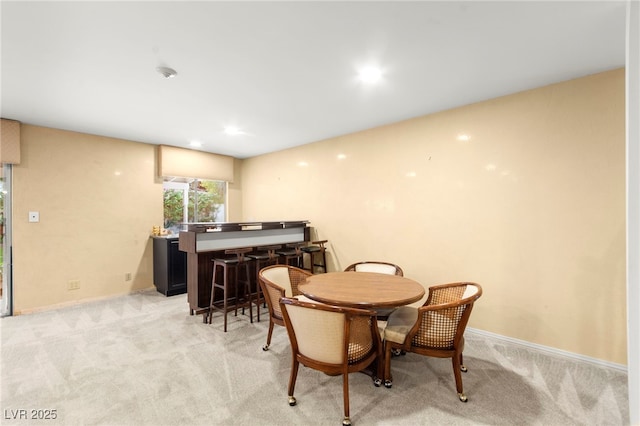 226 Dalmatian Ln, Las Vegas, NV 89107 - dining area featuring bar area and light carpet