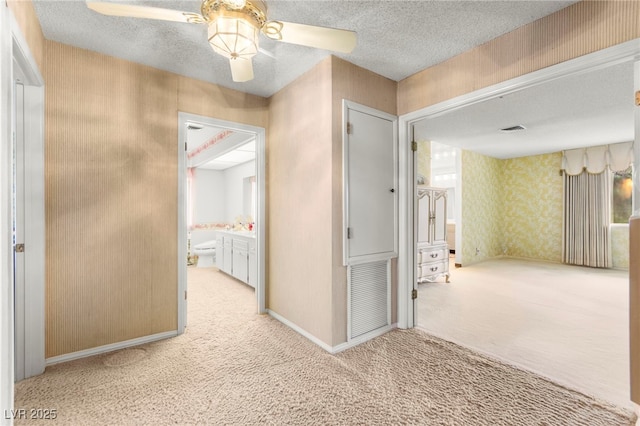 226 Dalmatian Ln, Las Vegas, NV 89107 - hall with carpet flooring, wallpapered walls, and a textured ceiling