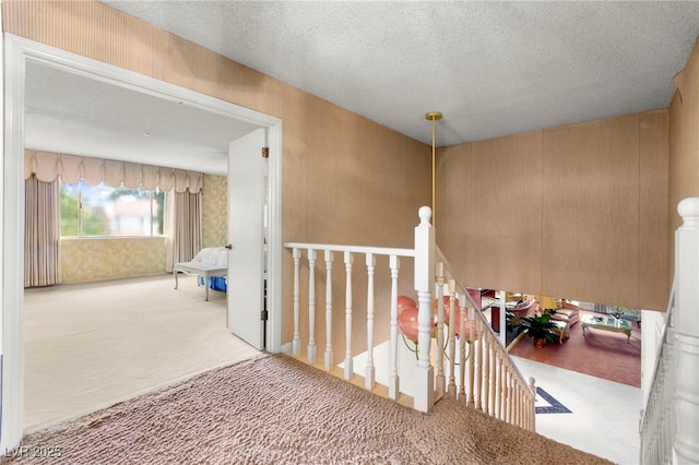 226 Dalmatian Ln, Las Vegas, NV 89107 - corridor featuring an upstairs landing, carpet floors, and a textured ceiling