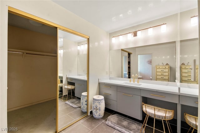 226 Dalmatian Ln, Las Vegas, NV 89107 - bathroom featuring vanity, tile patterned flooring, and a walk in closet