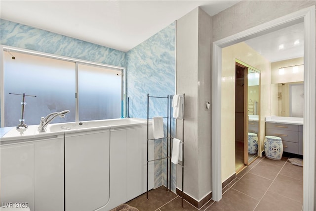 226 Dalmatian Ln, Las Vegas, NV 89107 - bathroom featuring vanity, tile patterned floors, and a garden tub