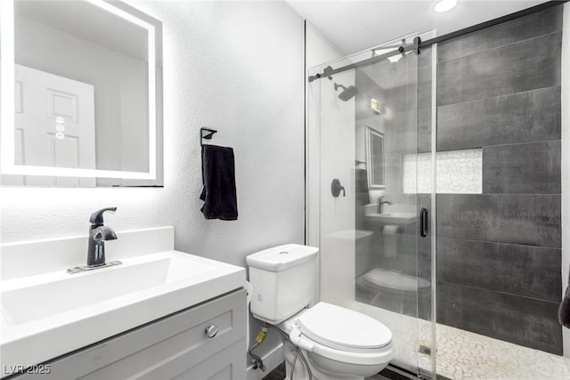 3825 Manhattan Bridge Pl, North Las Vegas, NV 89032 - bathroom with vanity, a stall shower, and a textured wall