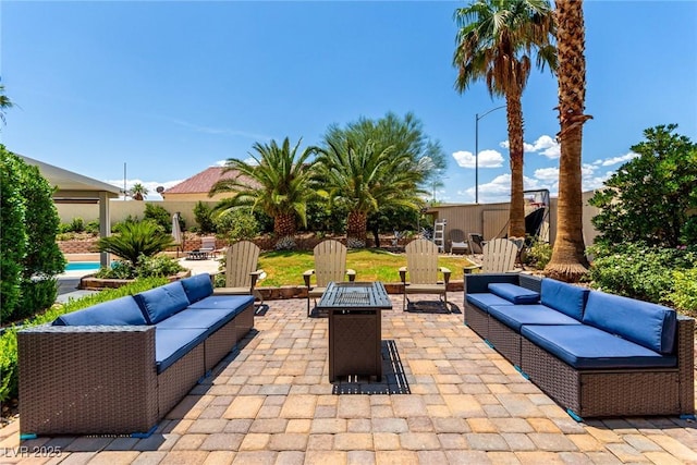 3825 Manhattan Bridge Pl, North Las Vegas, NV 89032 - view of patio featuring an outdoor living space with a fire pit