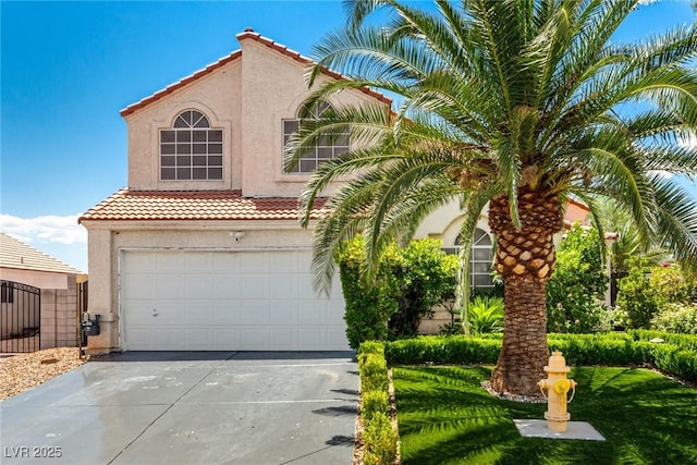 3825 Manhattan Bridge Pl, North Las Vegas, NV 89032 - mediterranean / spanish-style house with a tiled roof, stucco siding, concrete driveway, and a garage