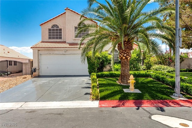 3825 Manhattan Bridge Pl, North Las Vegas, NV 89032 - mediterranean / spanish-style house featuring stucco siding, a tiled roof, an attached garage, and concrete driveway