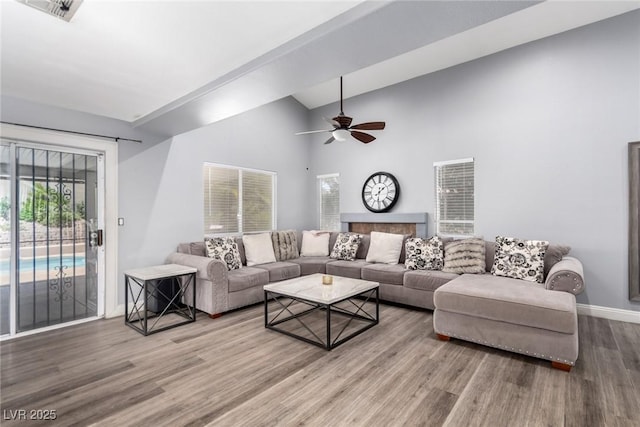 3825 Manhattan Bridge Pl, North Las Vegas, NV 89032 - living area with plenty of natural light, wood finished floors, a ceiling fan, and lofted ceiling