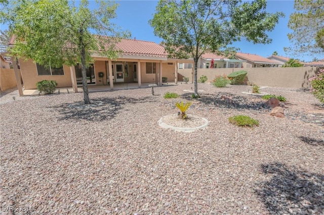 1174 Monogram Way, Las Vegas, NV 89123 - rear view of property featuring a tile roof, stucco siding, a fenced backyard, and a patio area